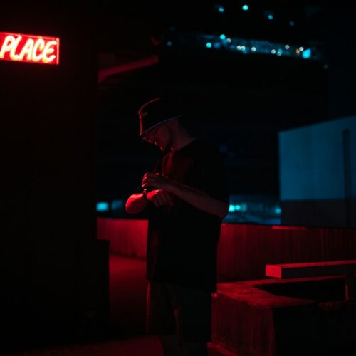 Independent music artist recording in a dark studio