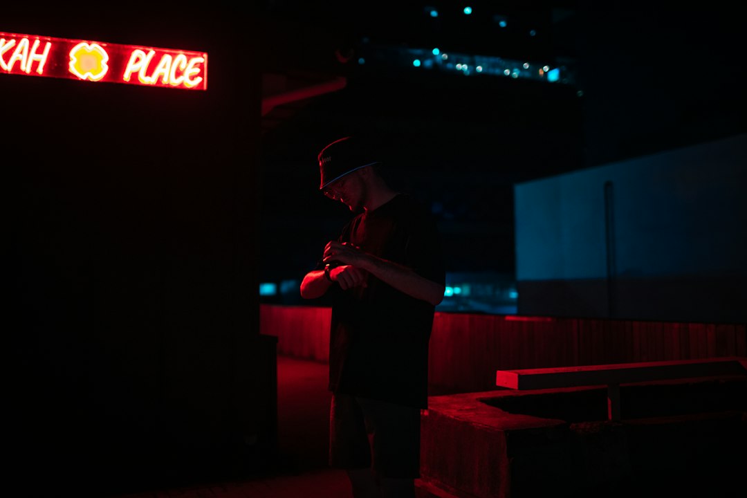Independent music artist recording in a dark studio